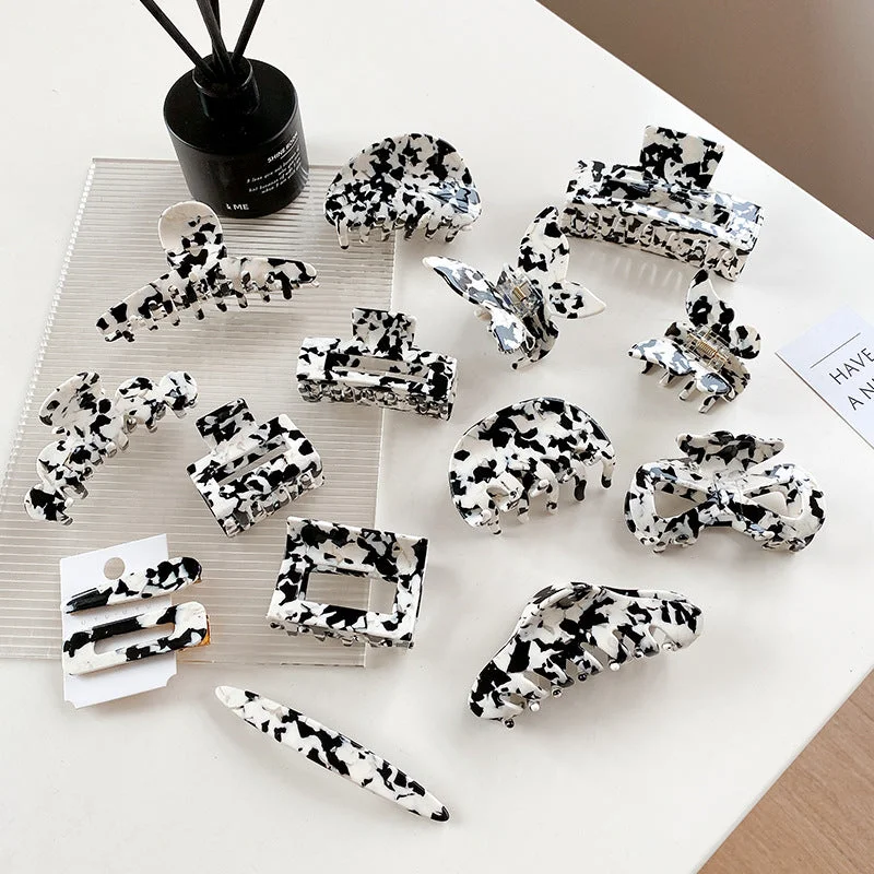 Wholesale Cow Black and White Medium Hollow Acetate Plate Hair Clips